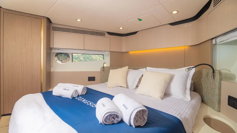 Genesis Yacht Photos Pics Luxurious bedroom interior of 2023 Azimut Fly 60 yacht with elegant bedding and modern design.