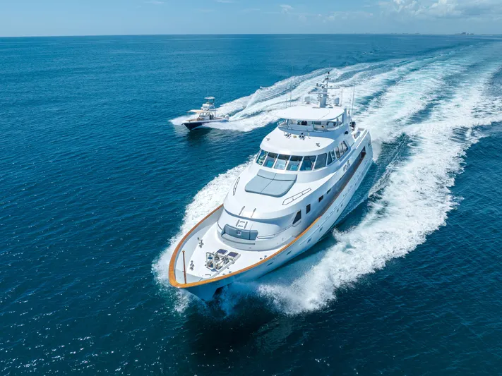 Gale Winds Yacht Photos Pics Delta Marine 1996 Tri-Deck Enclosed Aft Deck yacht cruising on open water.