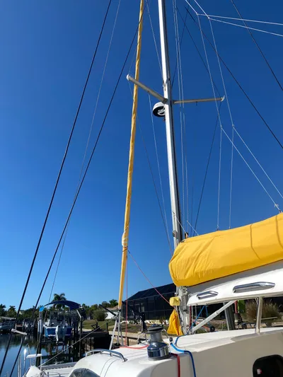 Sandy Pause Yacht Photos Pics 2003 Leopard 47 sailboat with yellow sail.