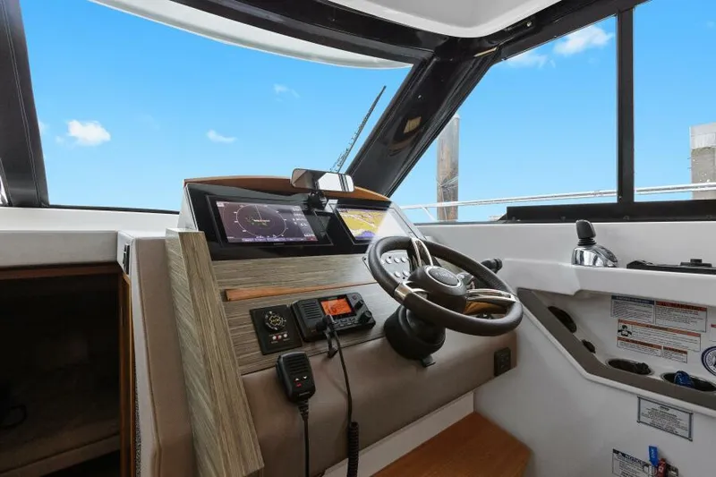 Big Eyes Yacht Photos Pics 2019 Tiara Yachts 39 Coupe helm with modern navigation equipment and steering wheel.