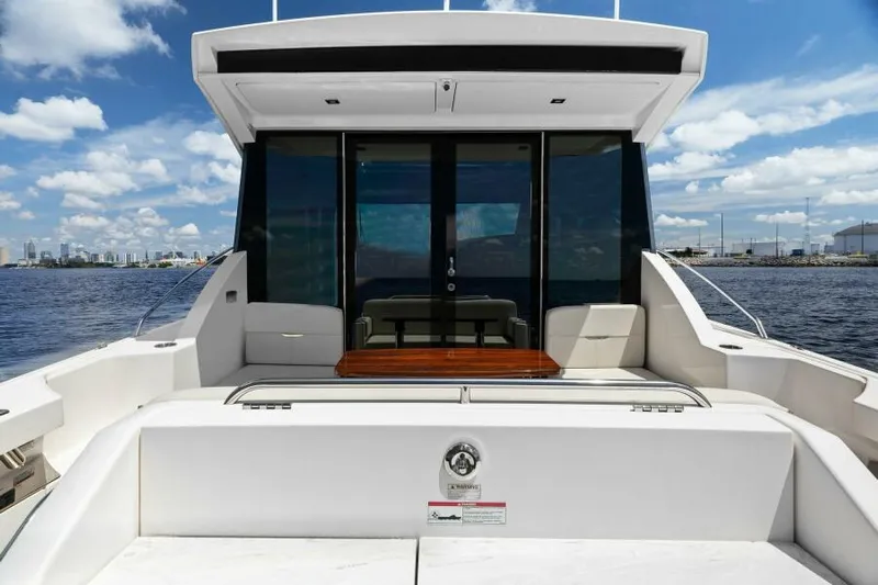 Big Eyes Yacht Photos Pics 2019 Tiara Yachts 39 Coupe on water, rear view with seating area.