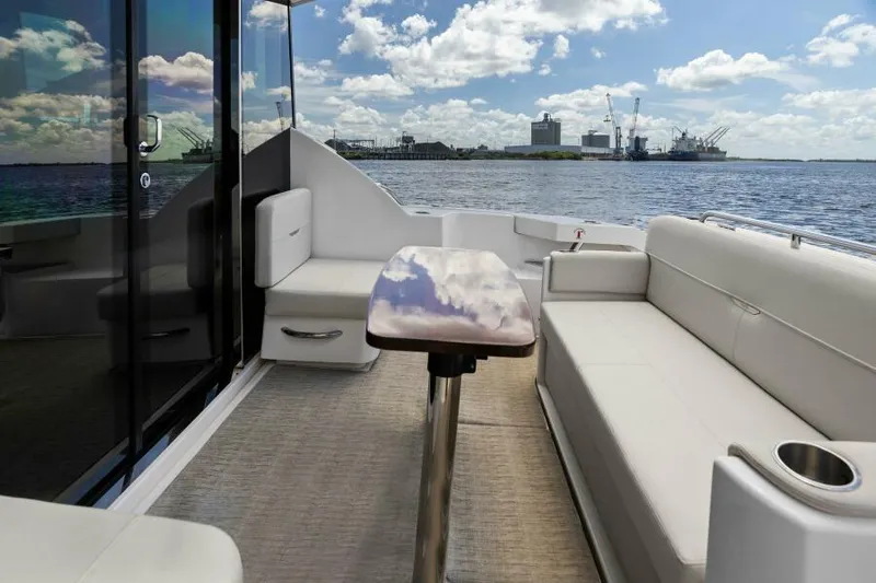 Big Eyes Yacht Photos Pics 2019 Tiara Yachts 39 Coupe interior with plush seating and scenic water view.