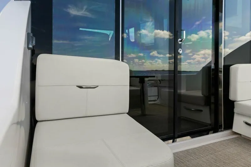 Big Eyes Yacht Photos Pics 2019 Tiara Yachts 39 Coupe interior with plush seating and glass doors.