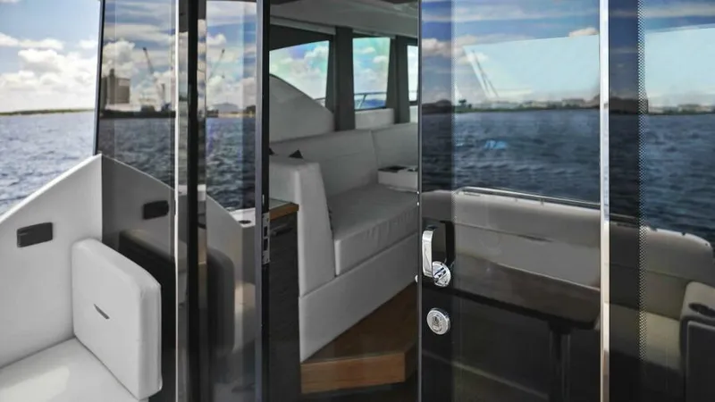 Big Eyes Yacht Photos Pics Interior view of 2019 Tiara Yachts 39 Coupe with ocean backdrop.