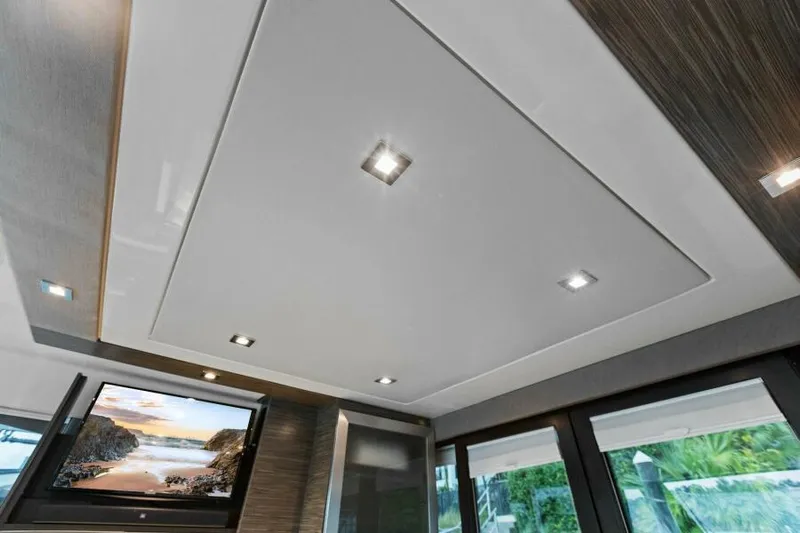 Big Eyes Yacht Photos Pics Interior ceiling of 2019 Tiara Yachts 39 Coupe with recessed lighting and TV.