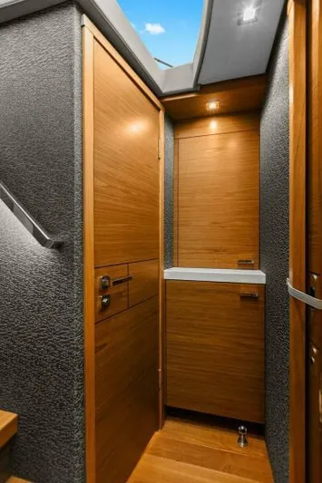 Big Eyes Yacht Photos Pics Interior of 2019 Tiara Yachts 39 Coupe, featuring sleek wood paneling and modern design.