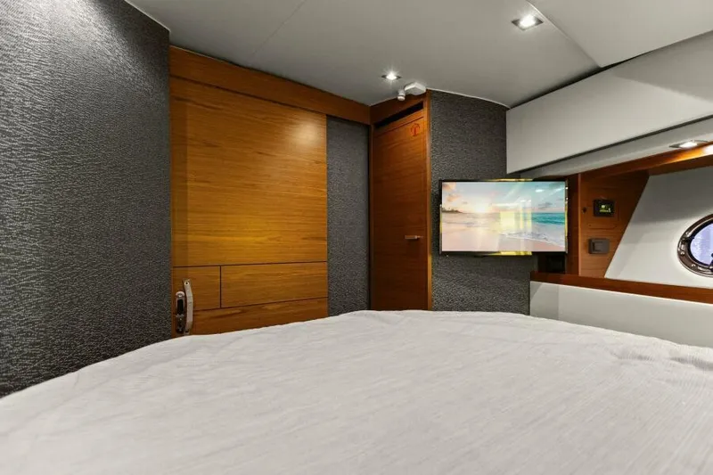 Big Eyes Yacht Photos Pics Luxurious interior of 2019 Tiara Yachts 39 Coupe with modern wood paneling and flat-screen TV.