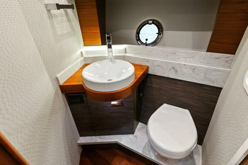 Big Eyes Yacht Photos Pics Luxurious bathroom in 2019 Tiara Yachts 39 Coupe with modern sink and toilet.