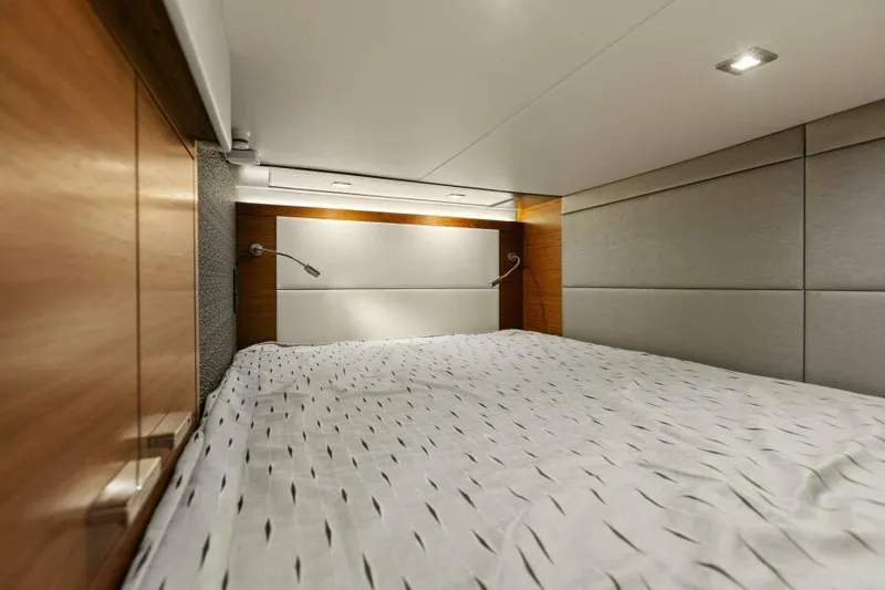 Big Eyes Yacht Photos Pics Luxurious 2019 Tiara Yachts 39 Coupe cabin interior with modern bedding and lighting.