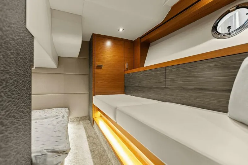 Big Eyes Yacht Photos Pics Interior of 2019 Tiara Yachts 39 Coupe, featuring modern wood and fabric design.