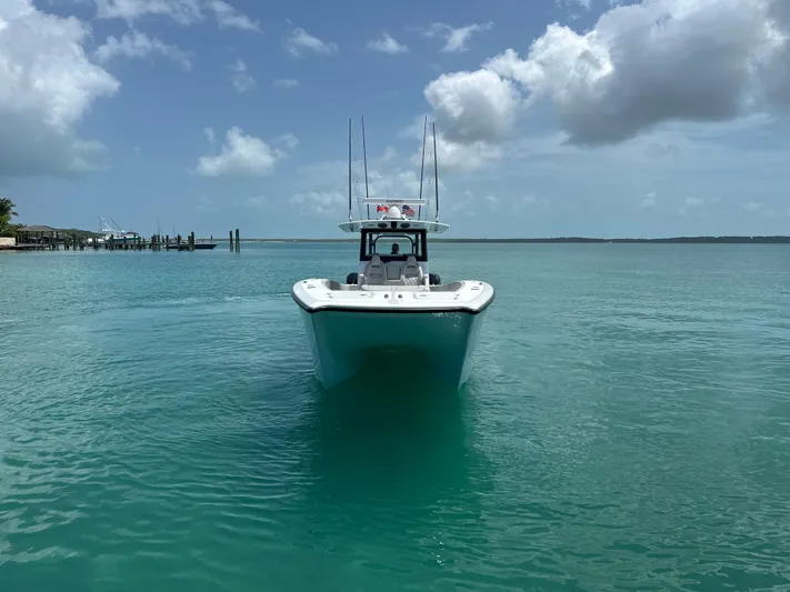  Yacht Photos Pics Freeman 38 boat on clear turquoise water under a partly cloudy sky, 2025 model.