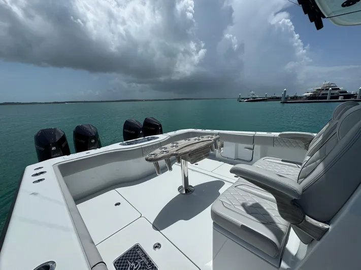  Yacht Photos Pics Luxury Freeman 38 boat interior with seating, ocean view, and Mercury engines, 2025 model.