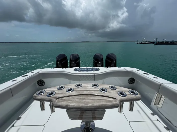  Yacht Photos Pics 2025 Freeman 38 boat with multiple engines on a calm sea under cloudy skies.