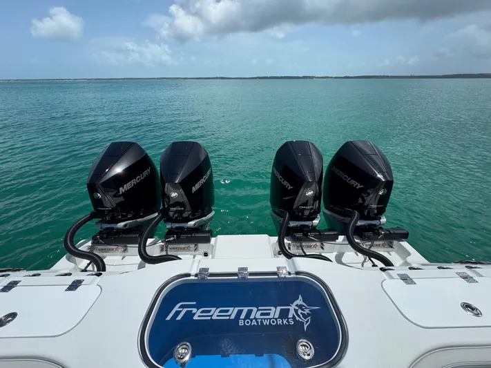  Yacht Photos Pics Freeman 38 boat with four Mercury engines on a calm sea, 2025 model.