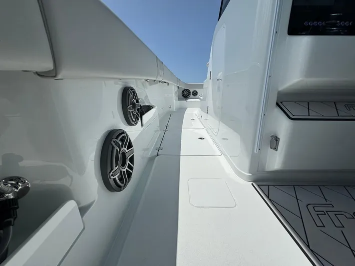  Yacht Photos Pics Sleek interior of a 2025 Freeman 38 boat, featuring modern design and audio speakers.