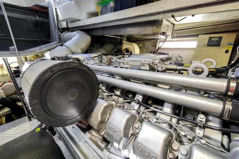 Alchemy Yacht Photos Pics Engine room of 2003 Baia PANTHER 80 yacht, showcasing detailed mechanical components.