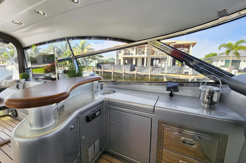 Alchemy Yacht Photos Pics Luxurious interior of 2003 Baia PANTHER 80 yacht with modern amenities and waterfront view.