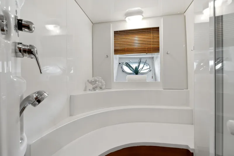 Alchemy Yacht Photos Pics Luxurious bathroom interior of 2003 Baia PANTHER 80 yacht with modern fixtures.