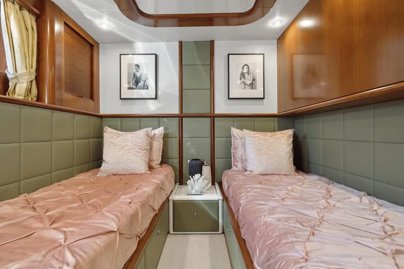 Alchemy Yacht Photos Pics Luxurious twin cabin interior on 2003 Baia PANTHER 80 yacht with elegant decor.