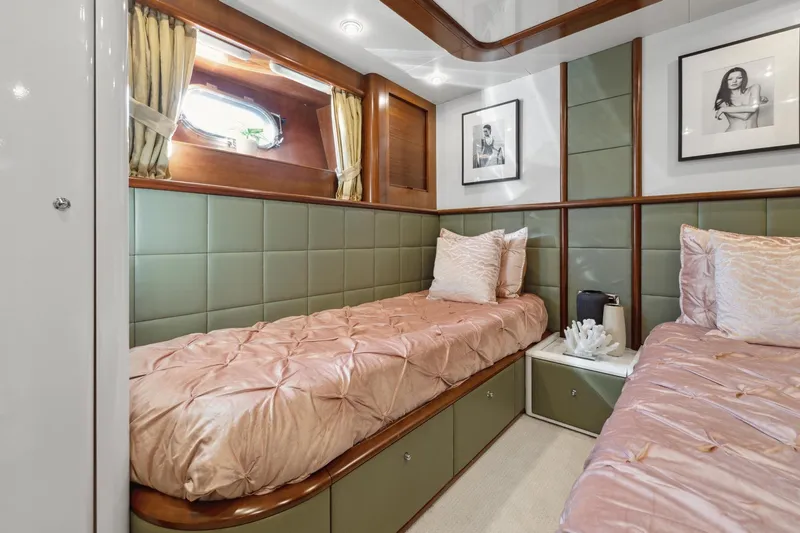 Alchemy Yacht Photos Pics Luxurious cabin interior of 2003 Baia PANTHER 80 yacht with twin beds and elegant decor.