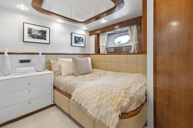 Alchemy Yacht Photos Pics Luxurious cabin interior of 2003 Baia PANTHER 80 yacht with elegant bedding and decor.