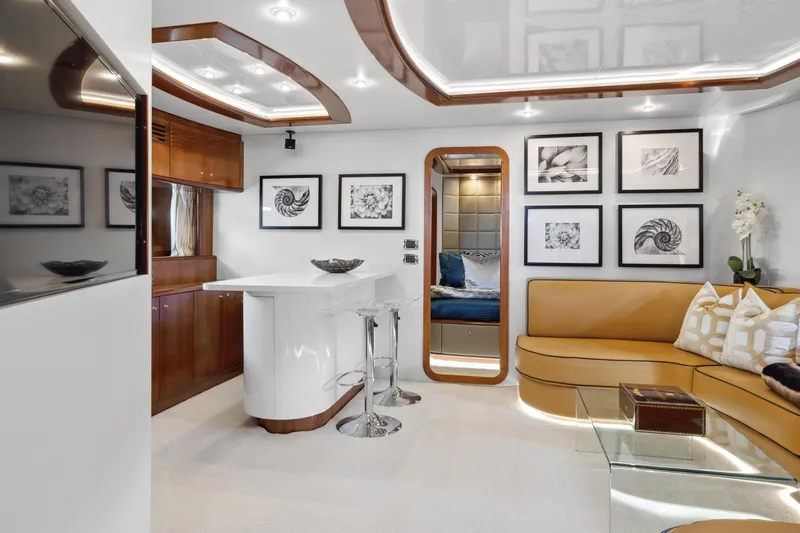 Alchemy Yacht Photos Pics Luxurious interior of 2003 Baia PANTHER 80 yacht with modern decor and elegant seating.