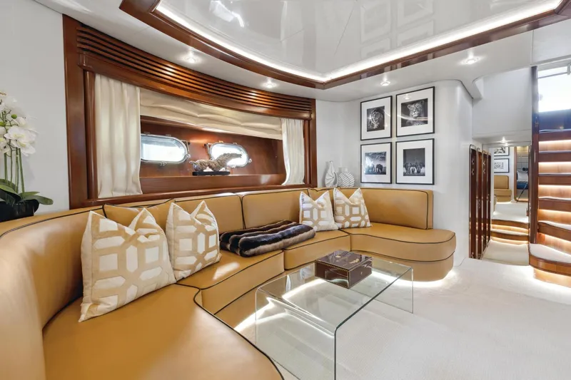Alchemy Yacht Photos Pics Luxurious interior of 2003 Baia PANTHER 80 yacht with elegant seating and decor.