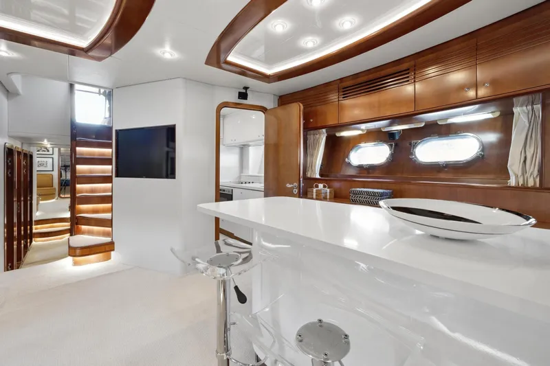 Alchemy Yacht Photos Pics Luxurious interior of 2003 Baia PANTHER 80 yacht with modern design and elegant furnishings.