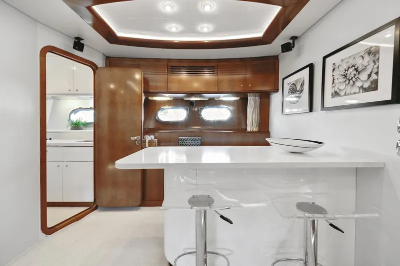 Alchemy Yacht Photos Pics Luxurious interior of 2003 Baia PANTHER 80 yacht with modern decor and sleek furnishings.