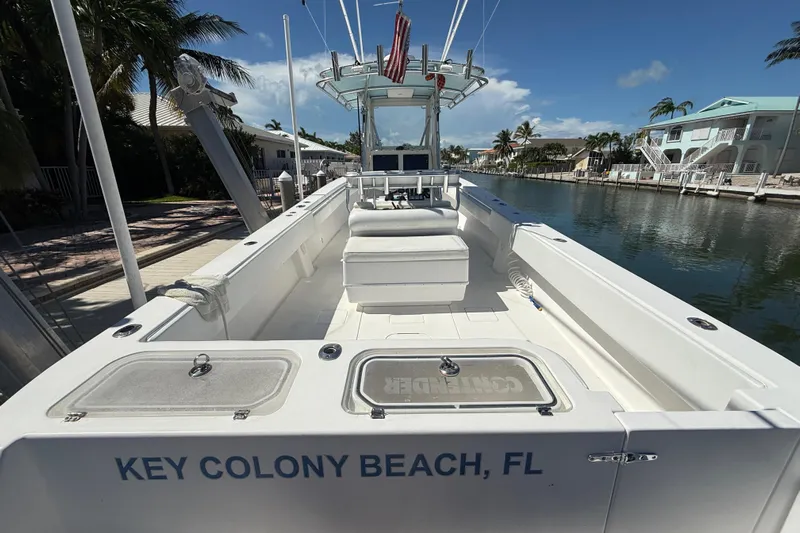  Yacht Photos Pics 2008 Contender 33 Tournament boat docked at Key Colony Beach, FL, under clear skies.