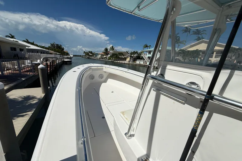  Yacht Photos Pics 2008 Contender 33 Tournament boat docked in sunny marina, clear skies above.