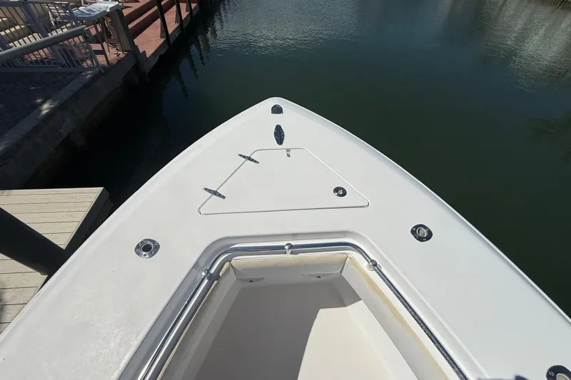  Yacht Photos Pics Bow of 2008 Contender 33 Tournament boat docked by the water.