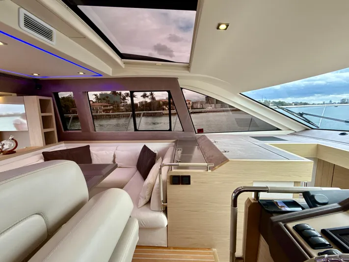  Yacht Photos Pics Interior of 2017 Beneteau Monte Carlo 5S yacht with modern seating and panoramic windows.