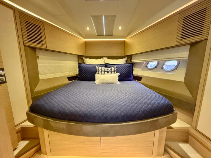  Yacht Photos Pics Luxurious cabin interior of 2017 Beneteau Monte Carlo 5S yacht with elegant bedding.
