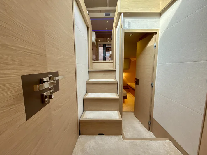  Yacht Photos Pics Interior of 2017 Beneteau Monte Carlo 5S yacht, featuring modern wooden staircase and elegant design.