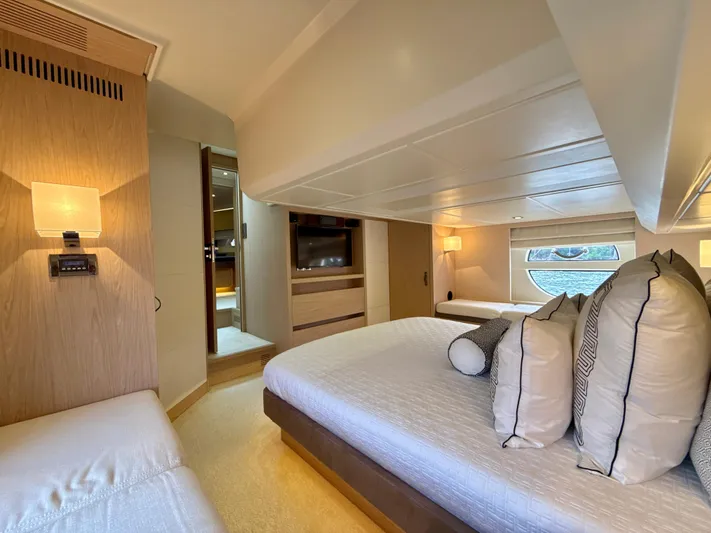  Yacht Photos Pics Luxurious cabin interior of 2017 Beneteau Monte Carlo 5S yacht, featuring elegant bedding and lighting.