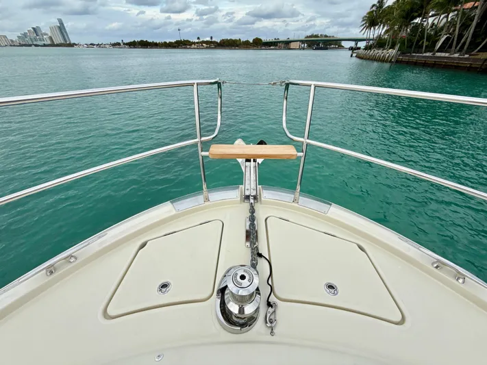  Yacht Photos Pics Bow view of 2017 Beneteau Monte Carlo 5S yacht on turquoise water.