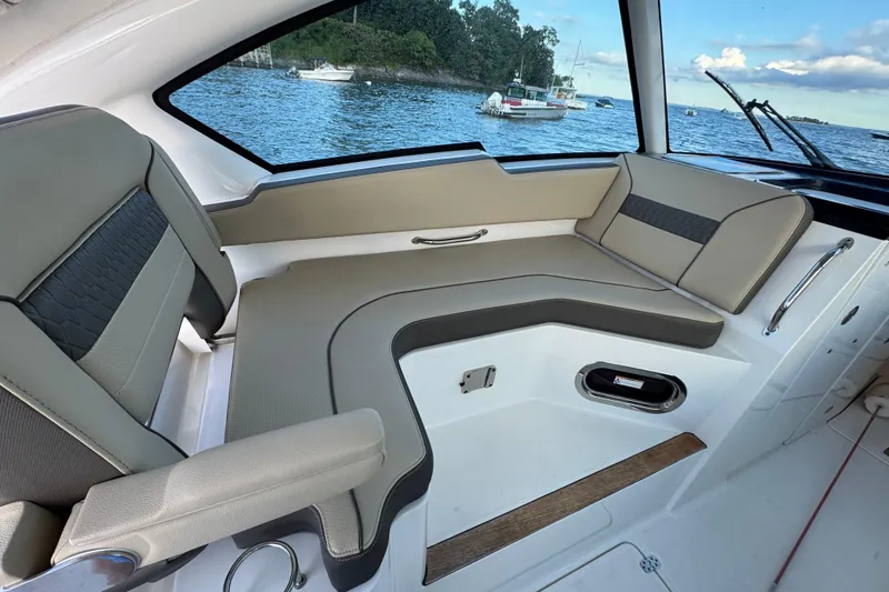  Yacht Photos Pics 2021 Pursuit DC 326 Dual Console interior with comfortable seating and scenic water view.