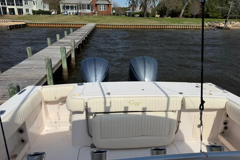  Yacht Photos Pics 2008 Grady-White Canyon 336 boat docked by a wooden pier on a sunny day.