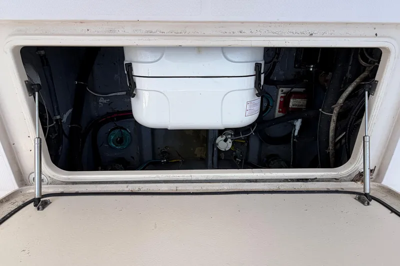  Yacht Photos Pics Open hatch of 2008 Grady-White Canyon 336 boat showing interior components.