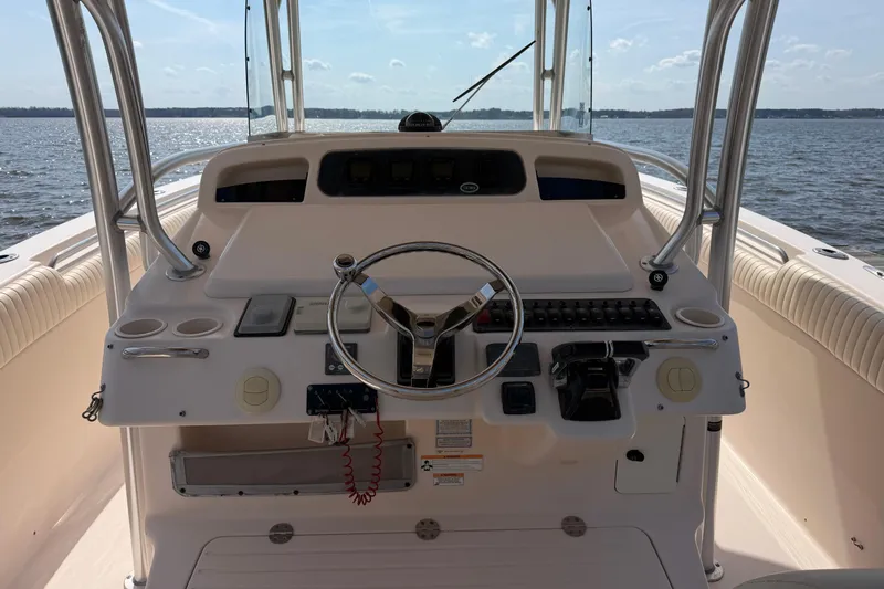  Yacht Photos Pics 2008 Grady-White Canyon 336 boat helm with steering wheel and controls on open water.