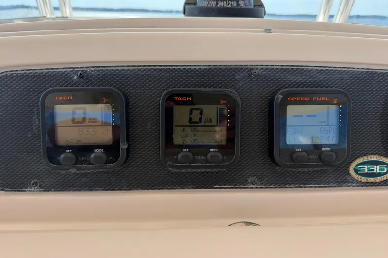  Yacht Photos Pics Dashboard of a 2008 Grady-White Canyon 336 boat with tachometer and speed fuel gauges.