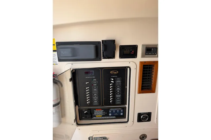  Yacht Photos Pics Control panel of a 2008 Grady-White Canyon 336 boat, featuring switches and gauges.