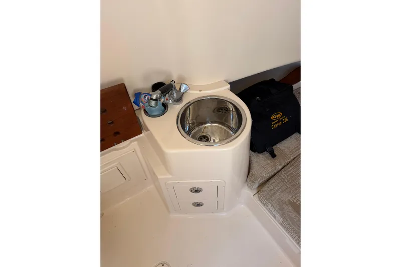  Yacht Photos Pics 2008 Grady-White Canyon 336 boat interior with sink and storage compartments.