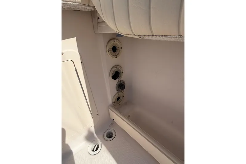  Yacht Photos Pics Interior view of a 2008 Grady-White Canyon 336 boat, showing seating and storage compartments.