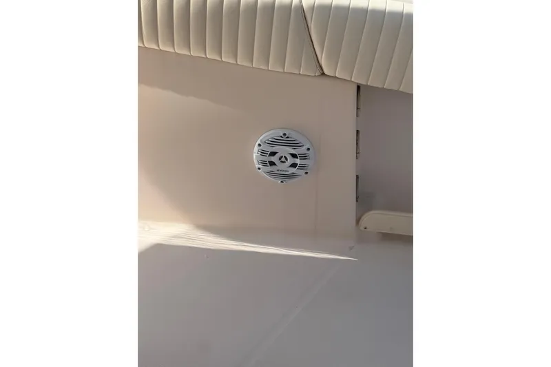  Yacht Photos Pics 2008 Grady-White Canyon 336 boat interior with speaker and cushioned seating.