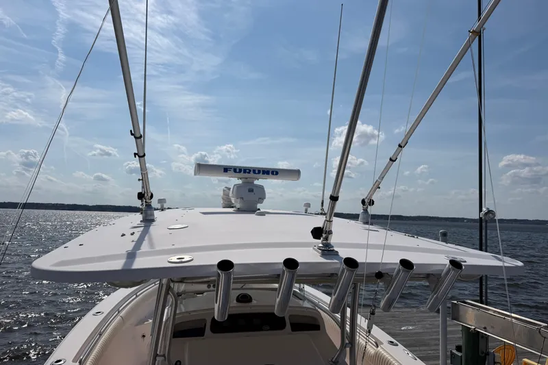  Yacht Photos Pics 2008 Grady-White Canyon 336 boat with fishing rod holders and radar on a sunny day.
