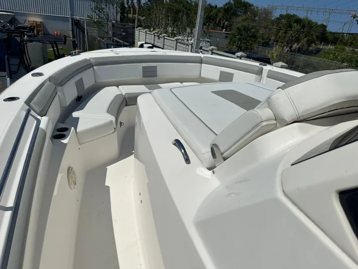  Yacht Photos Pics 2020 Pursuit S368 boat interior with white seating and spacious deck.