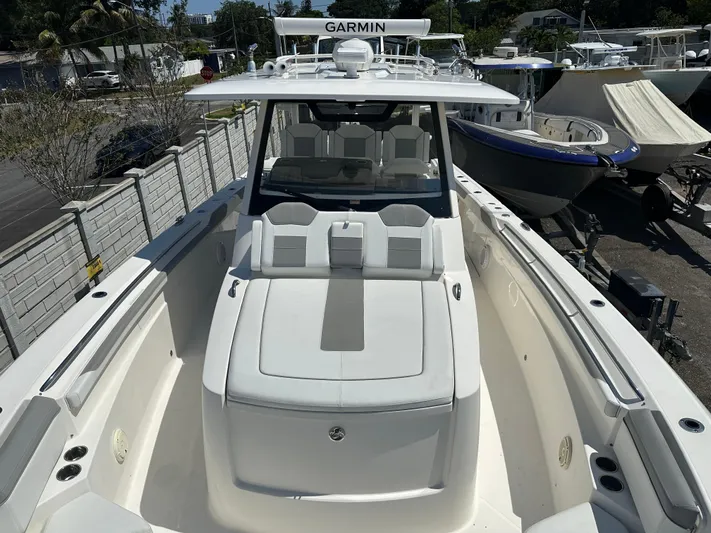  Yacht Photos Pics 2020 Pursuit S368 boat with Garmin equipment, docked in a marina.