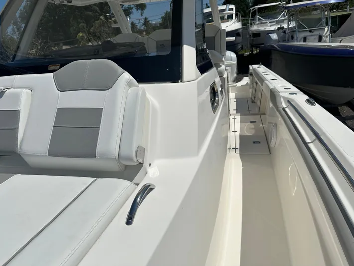  Yacht Photos Pics 2020 Pursuit S368 boat interior with sleek seating and modern design.